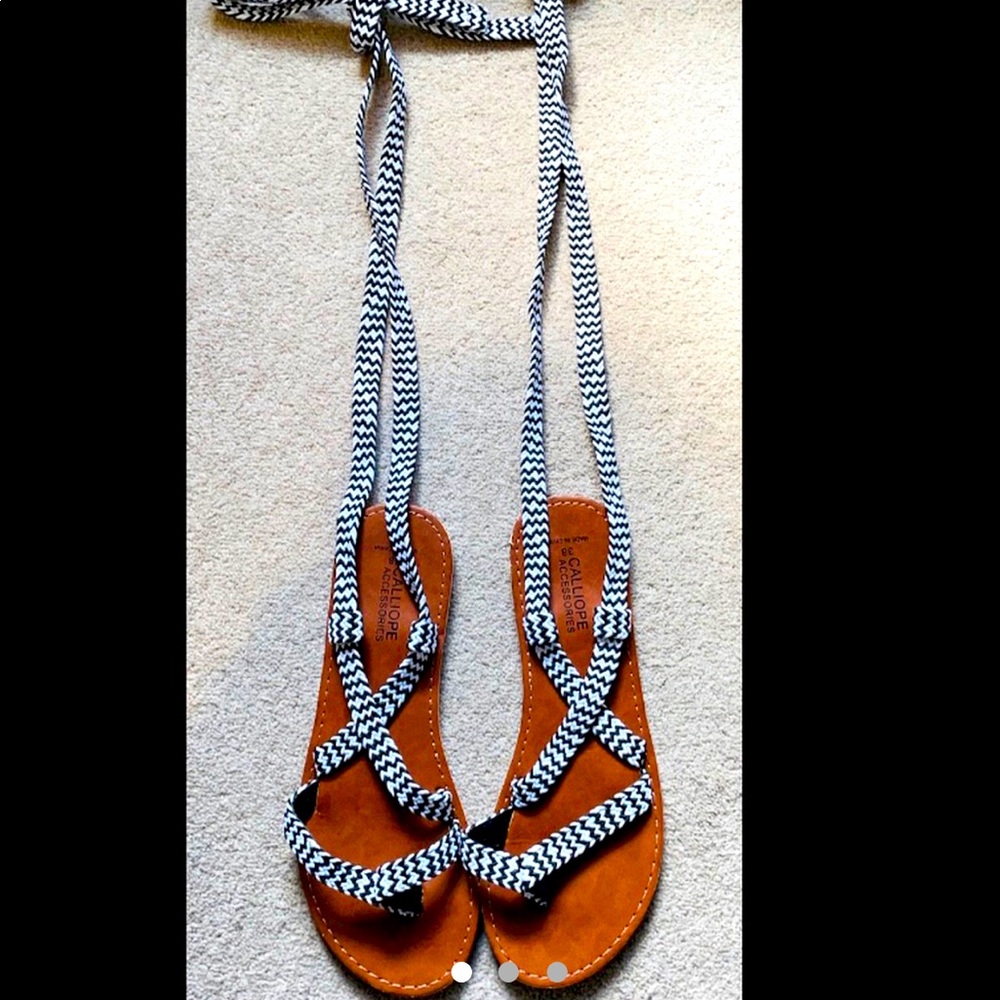 Super cute, boho, black & white lace up gladiator sandals 

NWOT